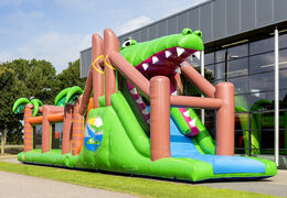 Buy a unique 17 meter wide crocodile themed obstacle course with 7 game elements and colorful objects for kids. Order inflatable obstacle courses now online at JB Inflatables UK