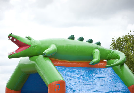 Order an inflatable multifun bouncy castle with roof and slide in a crocodile theme for kids with 3D object at the top at JB Inflatables UK. Buy inflatable bouncy castles online at JB Inflatables UK