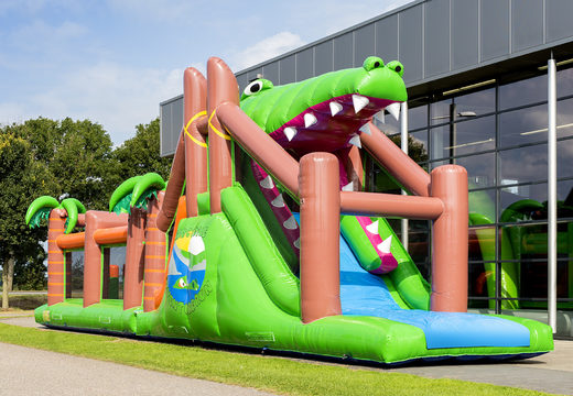 Buy a unique 17 meter wide crocodile themed obstacle course with 7 game elements and colorful objects for kids. Order inflatable obstacle courses now online at JB Inflatables UK