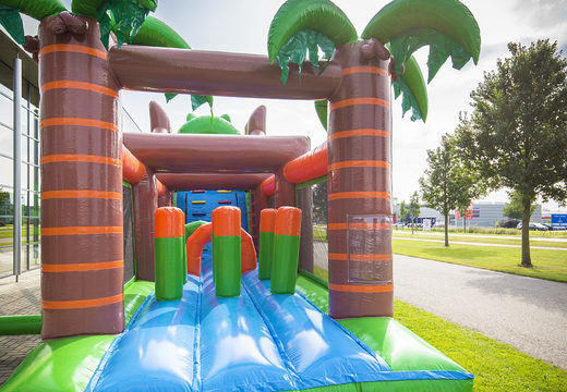 Buy inflatable unique 17 meter wide crocodile themed obstacle course with 7 game elements and colorful objects for children. Order inflatable obstacle courses now online at JB Inflatables UK