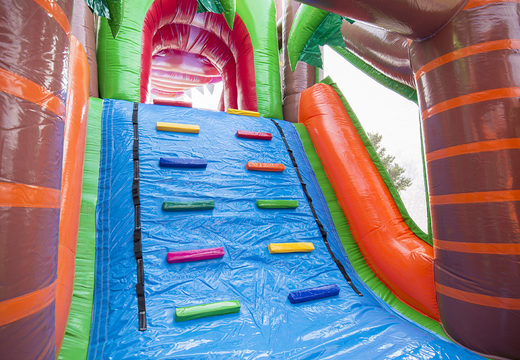 Crocodile themed inflatable obstacle course with 7 game elements and colorful objects for kids now. Order inflatable obstacle courses now online at JB Inflatables UK