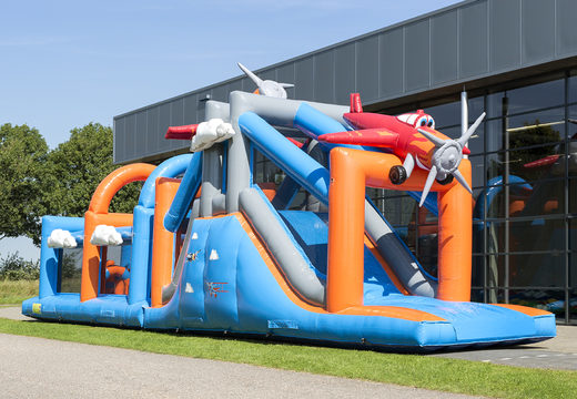 Buy a unique 17 meter wide airplane themed obstacle course with 7 game elements and colorful objects for kids. Order inflatable obstacle courses now online at JB Inflatables UK