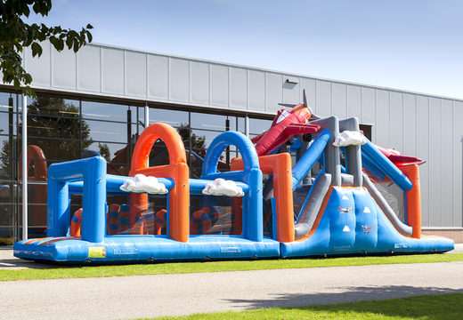 Buy a 17-meter-wide obstacle course in an airplane theme with 7 game elements and colorful objects for kids. Order inflatable obstacle courses now online at JB Inflatables UK