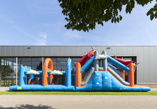 Order a 17 meter wide unique airplane themed obstacle course with 7 game elements and colorful objects for children. Buy inflatable obstacle courses online now at JB Inflatables UK