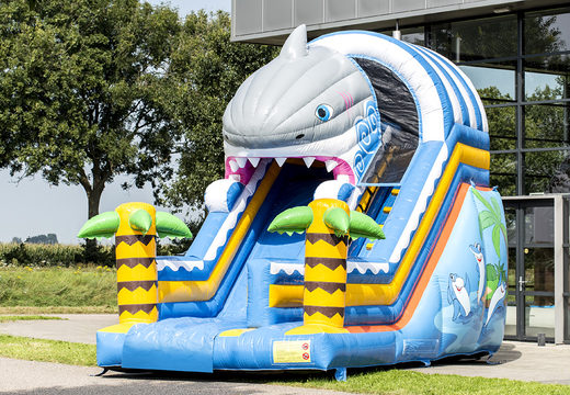 Buy Shark slide slide with the cheerful colors and nice print on the back wall. Order inflatable slides now online at JB Inflatables UK