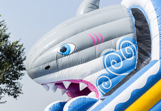 Get your inflatable shark slide with the cheerful colors and fun print on the back wall for children. Order inflatable slides now online at JB Inflatables UK