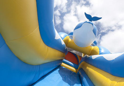 Inflatable slide in the dolphin theme with a splash pool, impressive 3D object, fresh colors and the 3D obstacle for children. Order inflatable slides now online at JB Inflatables UK