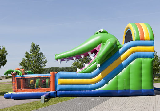 Multiplay inflatable slide in a crocodile theme with a splash pool, impressive 3D object, fresh colors and the 3D obstacle for children. Order inflatable slides now online at JB Inflatables UK