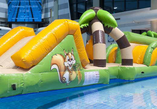 Slide double jungle run assault course with challenging obstacle objects for both young and old. Buy inflatable water attractions online now at JB Inflatables America