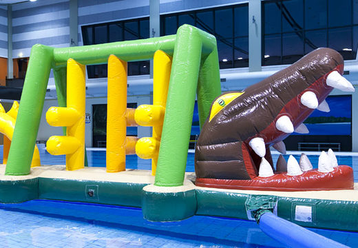 Buy a unique inflatable obstacle course in a crocodile theme with fun objects for both young and old. Order inflatable pool games now online at JB Inflatables America
