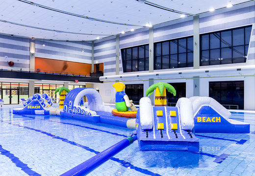 Get an airtight double inflatable 16 meter long surfer run swimming pool assault course in a unique design with funny 3D objects and no less than 2 slides for both young and old. Order inflatable obstacle courses online now at JB Inflatables America