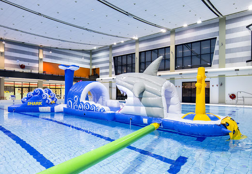 Shark run inflatable 13 meter long obstacle course in a unique design with funny 3D objects and no less than 2 slides for both young and old. Order inflatable pool obstacle courses now online at JB Inflatables America