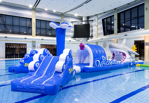 Unique 13 meter long inflatable obstacle course in shark run theme in unique design with funny 3D objects and no less than 2 slides for both young and old. Order inflatable pool games now online at JB Inflatables America