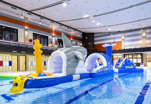 Order a 13-meter long swimming pool obstacle course shark run in a unique design with funny 3D objects and no less than 2 slides for both young and old. Buy inflatable water attractions online now at JB Inflatables America