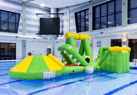 Buy an airtight crocodile inflatable play island with a vine, climbing tower, round slide and obstacles for both young and old. Order inflatable water attractions now online at JB Inflatables America