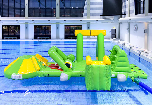 Inflatable airtight crocodile play island with a vine, climbing tower, round slide and obstacles for both young and old. Buy inflatable pool games now online at JB Inflatables America