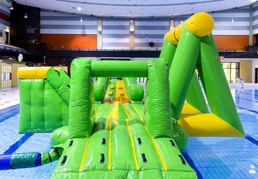 Order an airtight inflatable play island in a crocodile theme with a vine, climbing tower, round slide and obstacles for both young and old. Buy inflatable pool games now online at JB Inflatables America