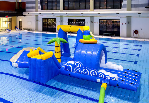Buy an airtight surfer inflatable play island with a vine, climbing tower, round slide and obstacles for both young and old. Order inflatable water attractions now online at JB Inflatables America