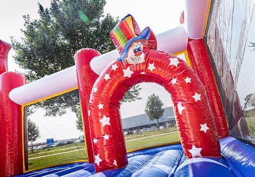 Bounce World circus bouncer with slides and all kinds of obstacles with circus prints for kids. Order bouncers online at JB Inflatables UK