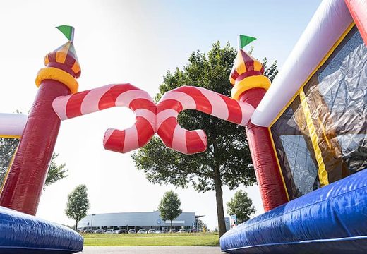 World circus bouncy castle with multiple slides and all kinds of obstacles with prints that match the theme for children. Buy bouncy castles online at JB Inflatables UK