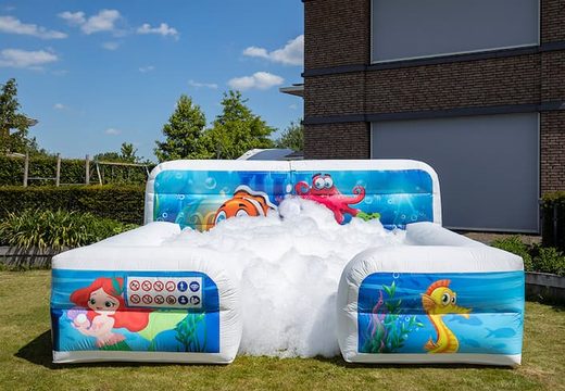 Bubble boarding park bouncy castle with a foam crane in the Seaworld theme for children. Buy inflatable bouncy castles online at JB Inflatables UK