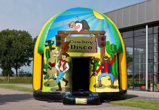 Multi-themed 5.5 meter  bouncbounce house for sale in Cowboy theme for children. Order inflatable bounce houses online at JB Inflatables UK