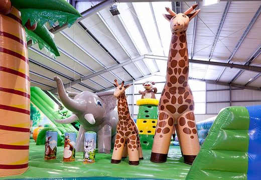 Huge 40 meters long and 20 meters wide Giga bouncy castle with 8 slides, 2 climbing towers, inflatable 3D animals, fun obstacles and obstacle courses for kids. Buy bouncy castles online at JB Inflatables  UK