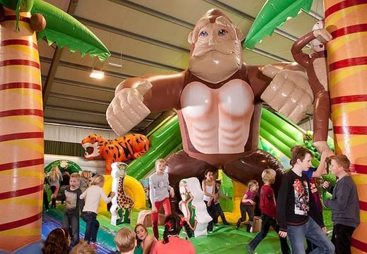 Multi-themed 40 meters long and 20 meters wide Giga bouncer with 8 slides, 2 climbing towers, inflatable 3D animals, fun obstacles and obstacle courses for kids. Order bouncers online at JB Inflatables  UK