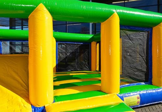 Multiplay indoor standard bouncy castle in a limited height of 2.74 meters and with a slide for children. Order bouncy castles online at JB Inflatables UK