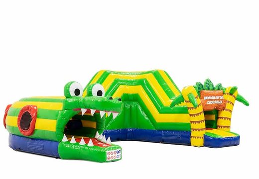 Order a crocodile crawl tunnel bouncy castle with obstacles, a climbing ramp and slide for children. Buy bouncy castles online at JB Inflatables UK