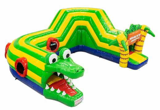 Buy an inflatable crocodile bouncy castle with obstacles, a climbing ramp and sliding ramp for children. Order bouncy castles online at JB Inflatables UK