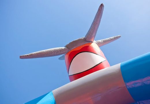 Big inflatable bouncy castle with roof in airplane theme for kids.  Buy bouncy castles at JB Inflatables UK online
