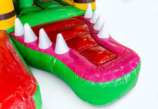 Indoor multiplay crocodile bounce house in a unique design with two entrances, a slide in the middle and 3D objects for kids. Buy bounce houses online at JB Inflatables UK