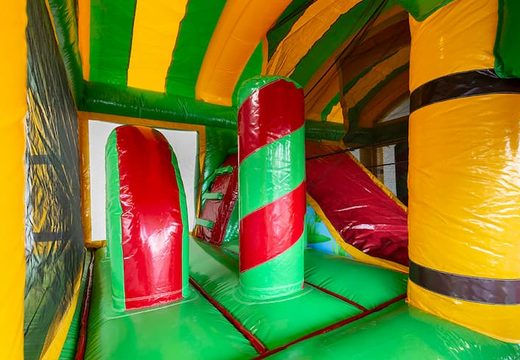 Order a crocodile bouncy castle in a unique design with two entrances, a slide in the middle and 3D objects for kids. Buy bouncy castles online at JB Inflatables UK