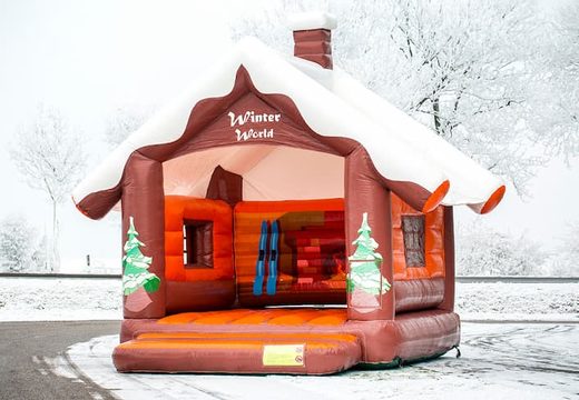 Skihut winterworld bouncy castle with a 3D chimney at the top for children. Order inflatable bouncy castles online at JB Inflatables UK