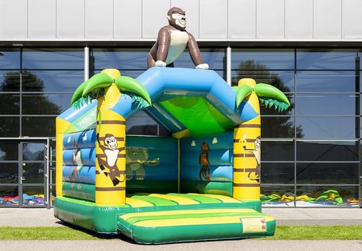 Standard jungle bouncy castle for sale in striking colors with a large gorilla 3D object on the top for children. Buy indoor bouncy castle online at JB Inflatables UK