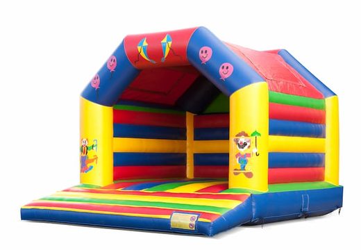 Big inflatable bouncy castle with roof in circus theme for sale for kids. Available at JB Inflatables UK online