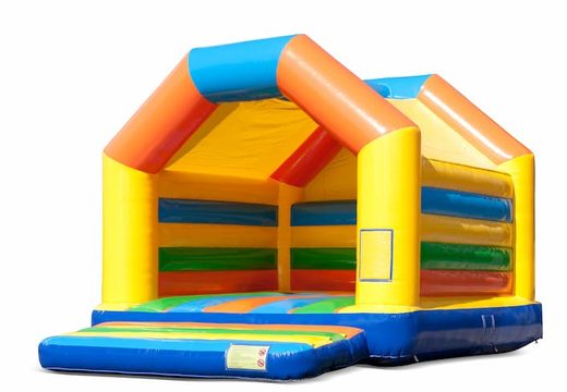 Buy a large indoor bounce house in the colours yellow, orange, green and blue for children. Order bounce houses online at JB Inflatables UK
