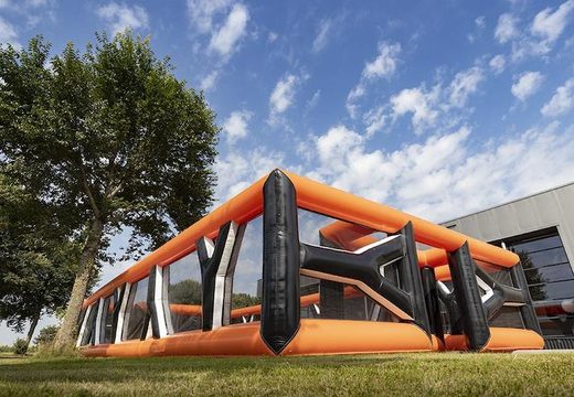 Orange inflatable archery boarding in which obstacles can be placed