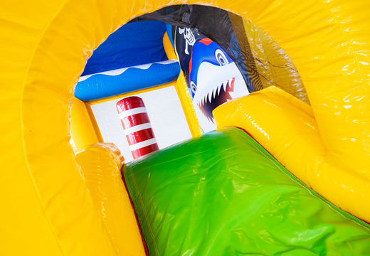 Inflatable bouncy castle in pirate theme with slide and play object for sale
