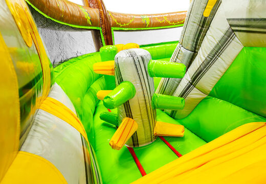 "Dinosaurs World" bouncy castle with an impressive 3D dinosaur above the entrance.